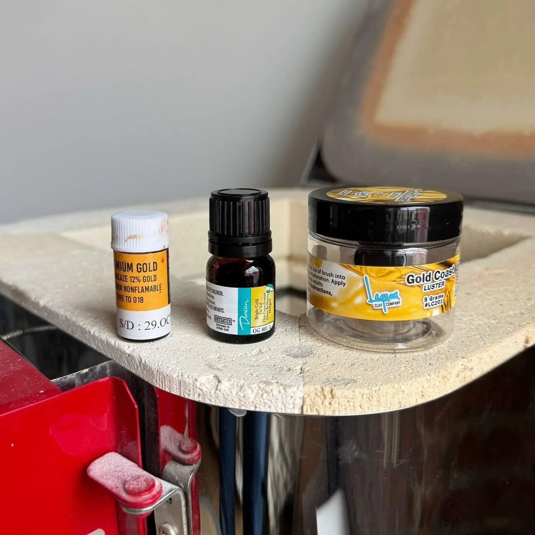 Gold luster ceramic test pieces comparing four popular brands