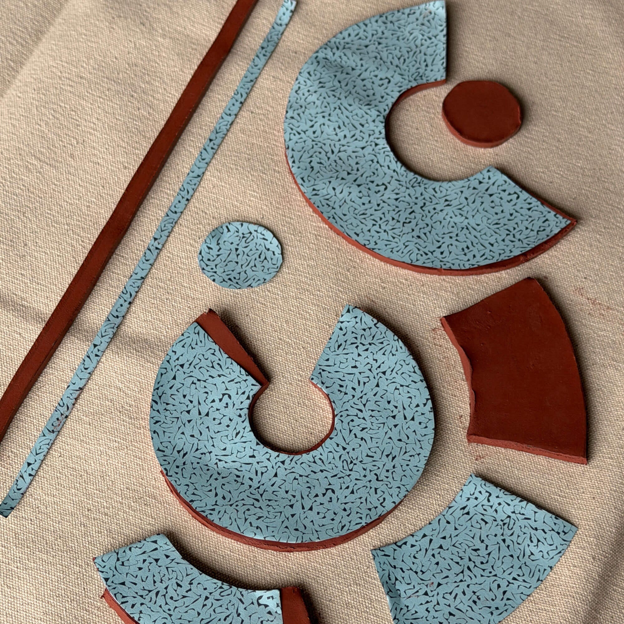 Decorative ceramic template pieces with blue and brown clay